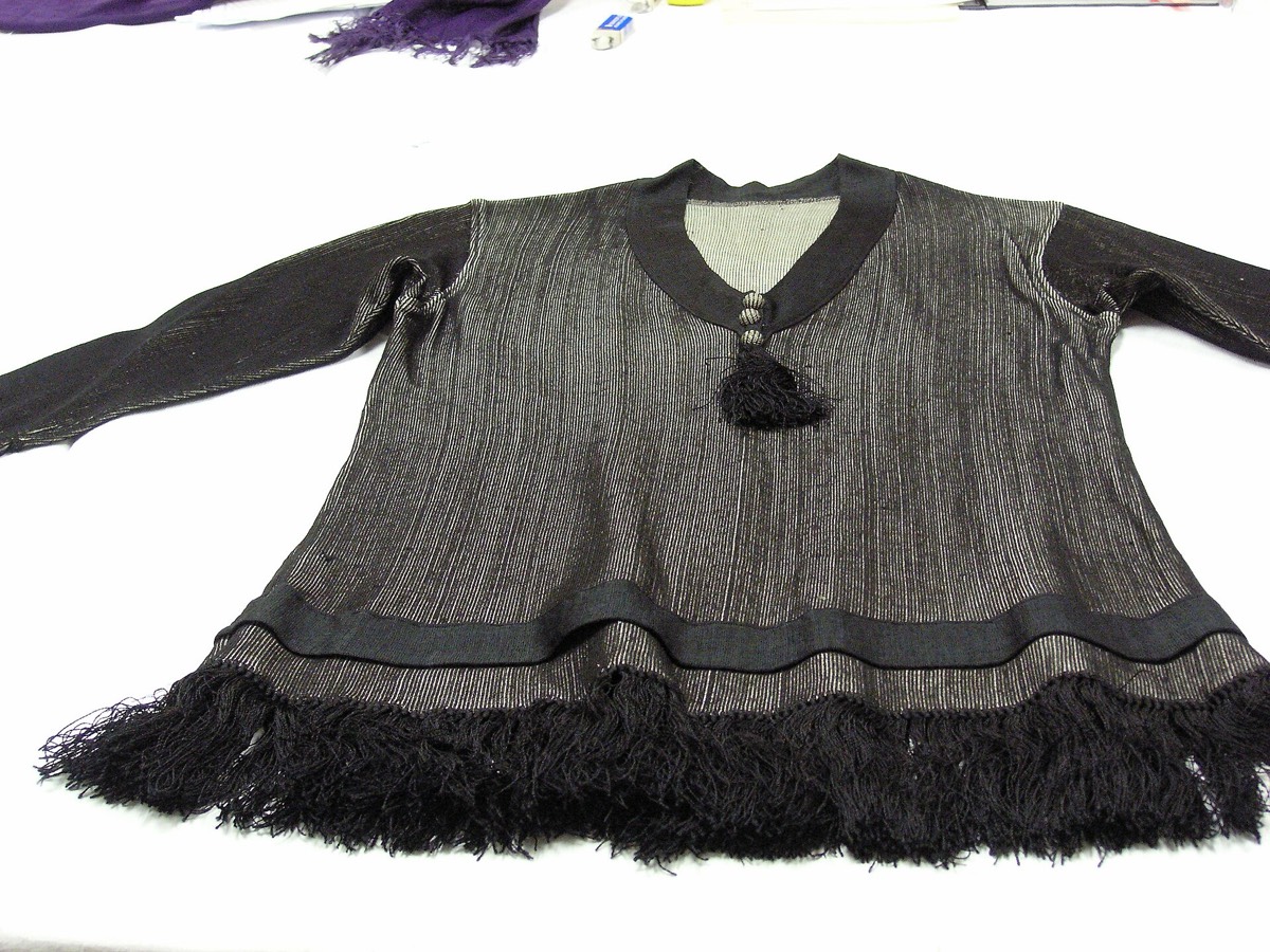 A knitted jumper with an inset sleeve