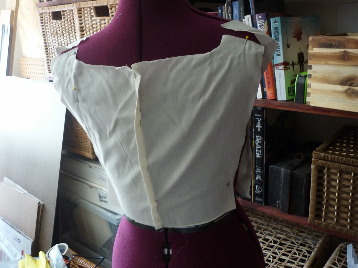 A muslin fitting on a dressmaker's dummy adjusted to body measurements