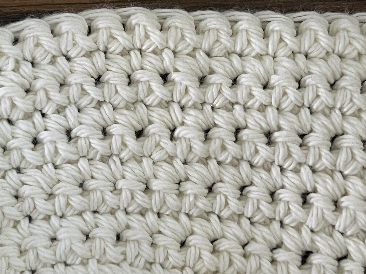 A single crochet swatch in cream yarn