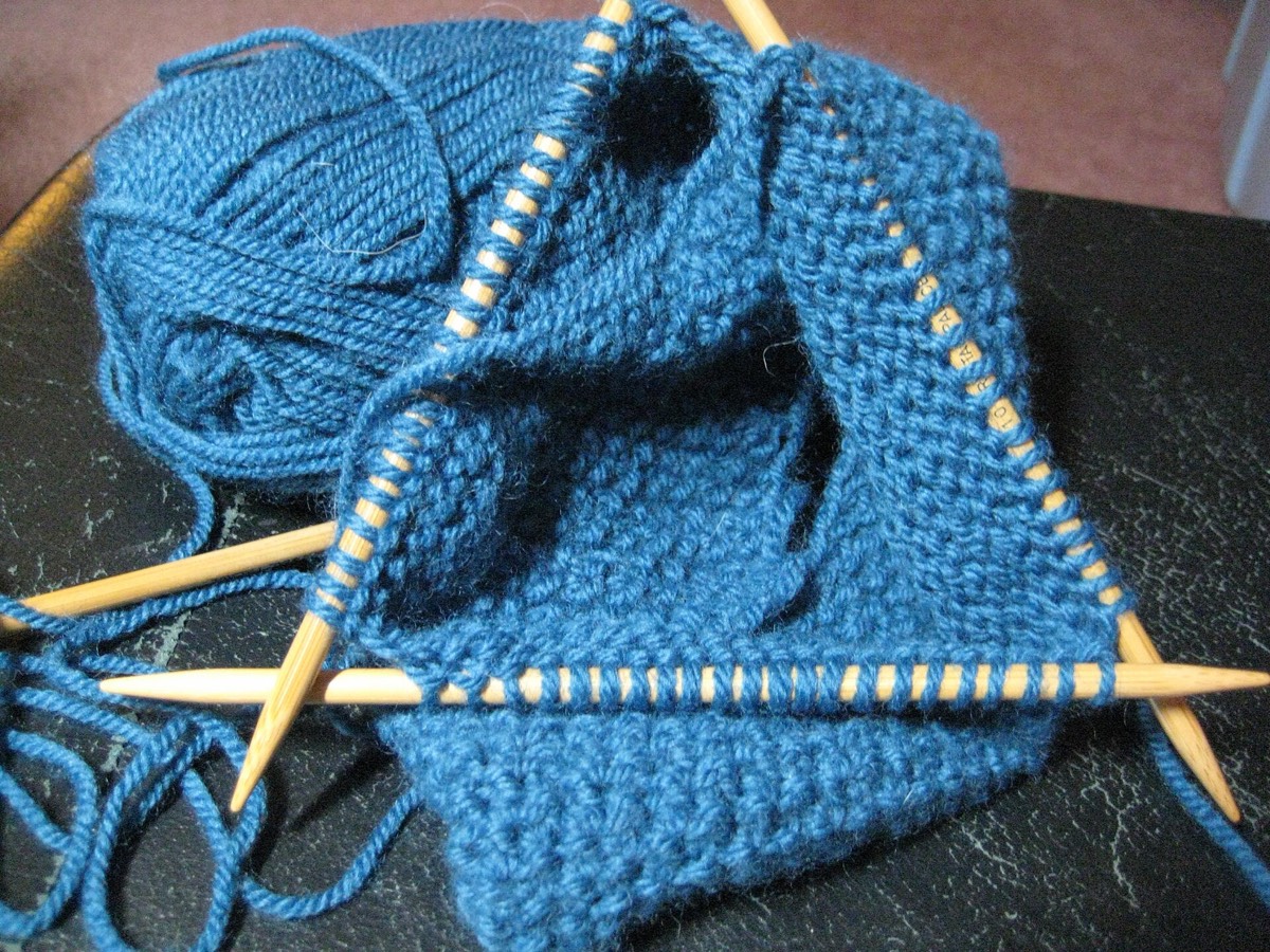 Double-pointed knitting needles in use on a small circumference