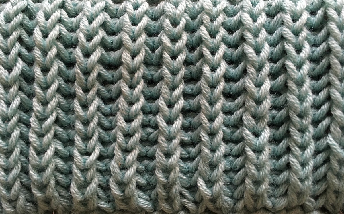 A fisherman's rib swatch in cream yarn
