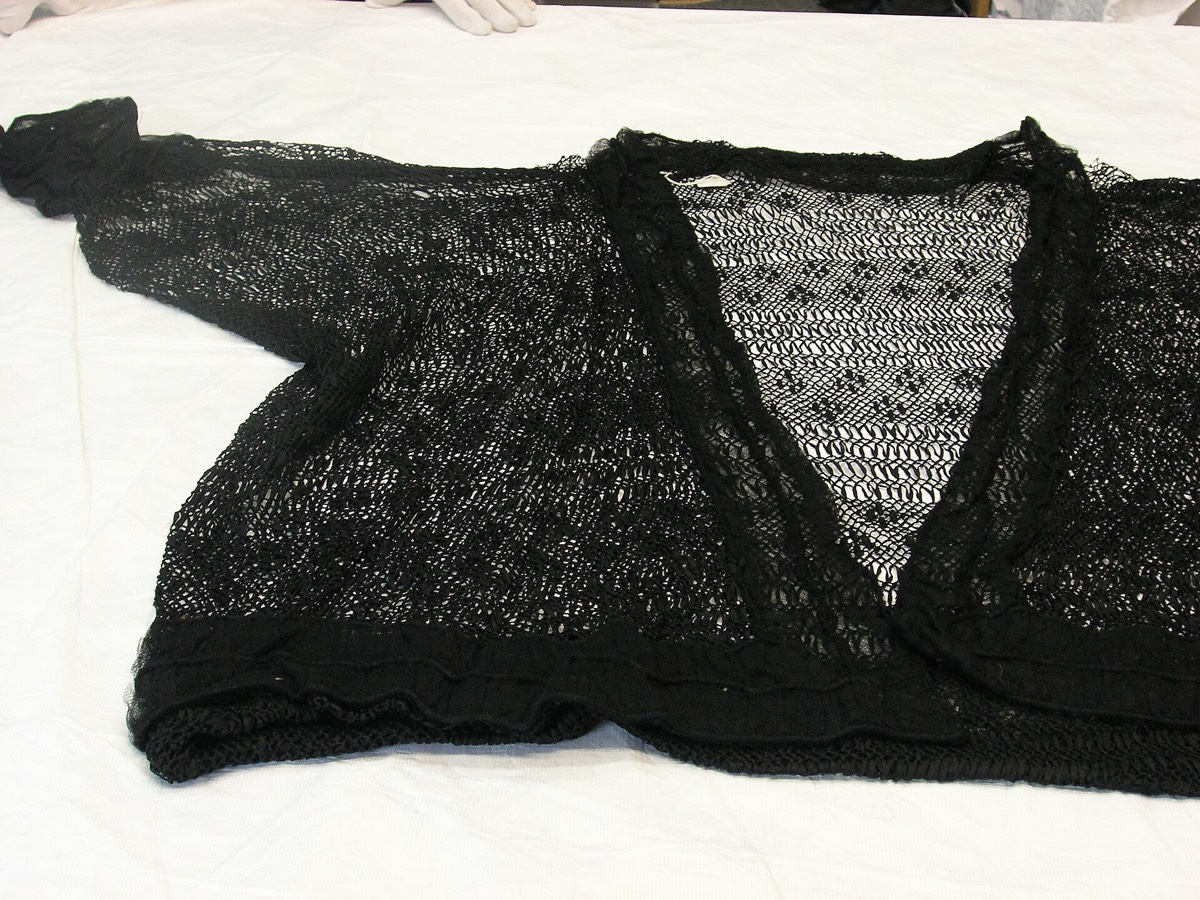 A knitted jacket with a shaped neckline