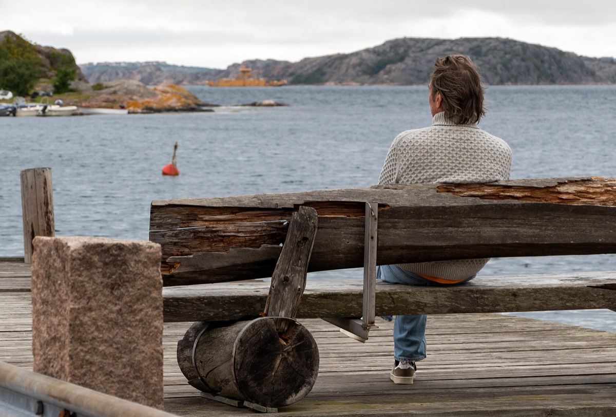 A person wearing a knitted sweater