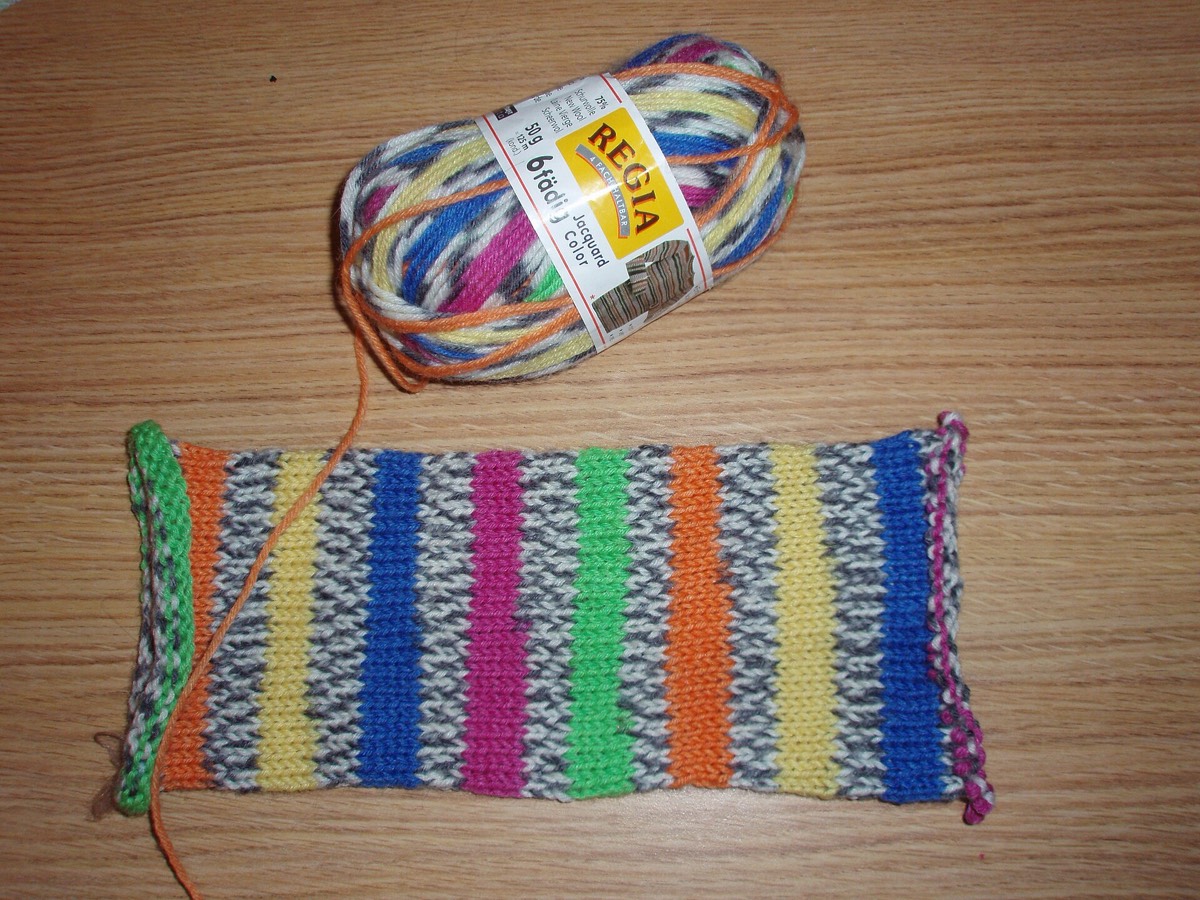 A ball of self-striping yarn showing its colour repeats