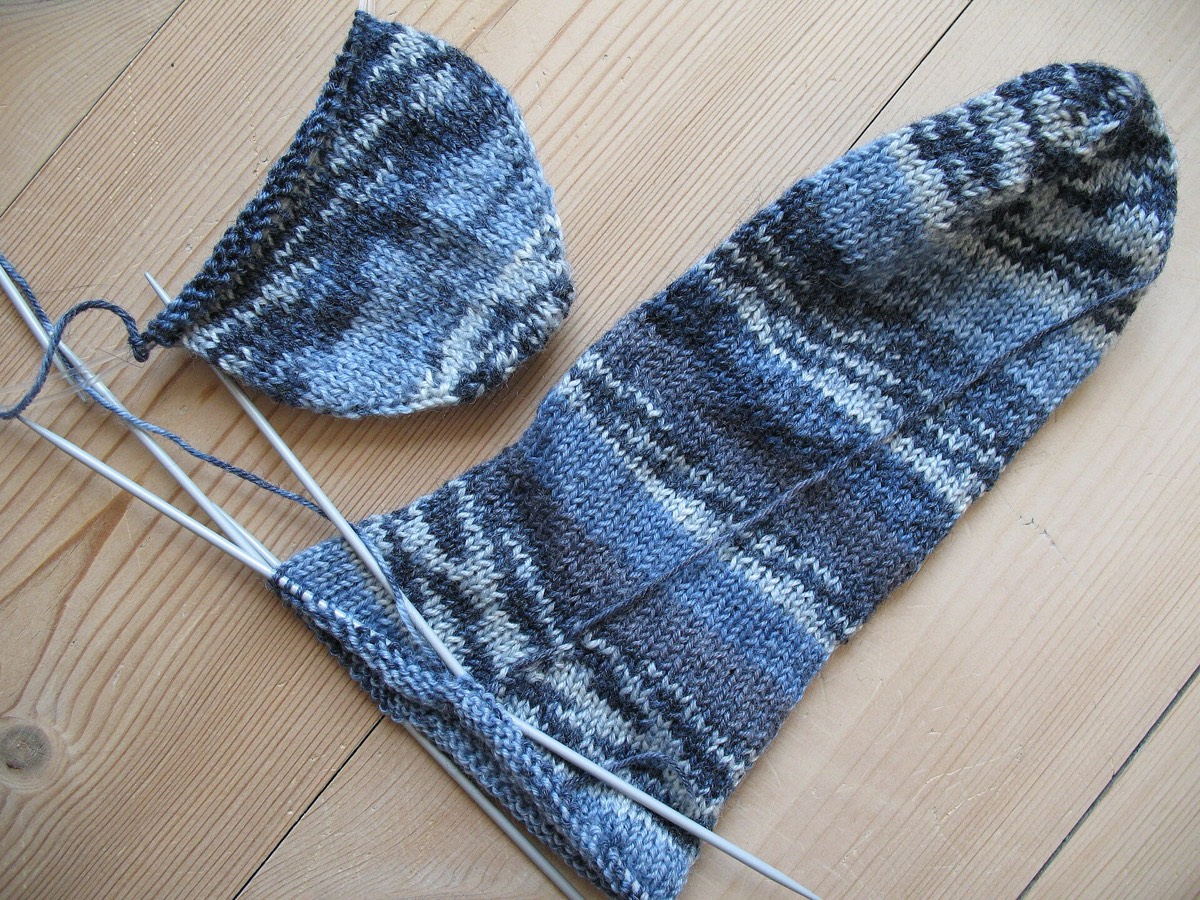Blue socks knitted in progress